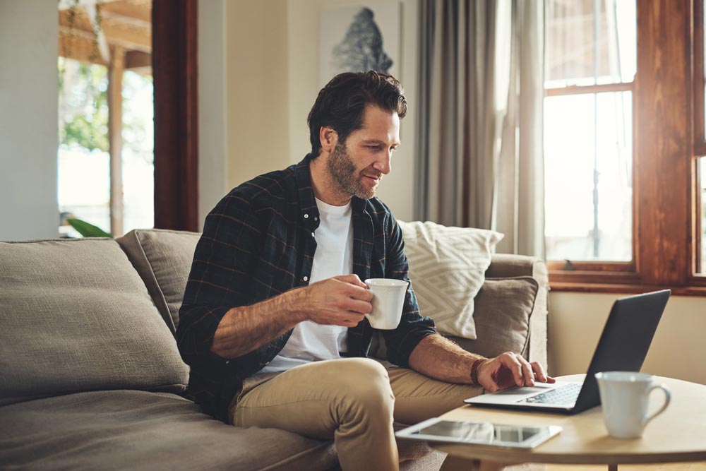 Sustainability and Improved Work-Life Balance. A man working from home.